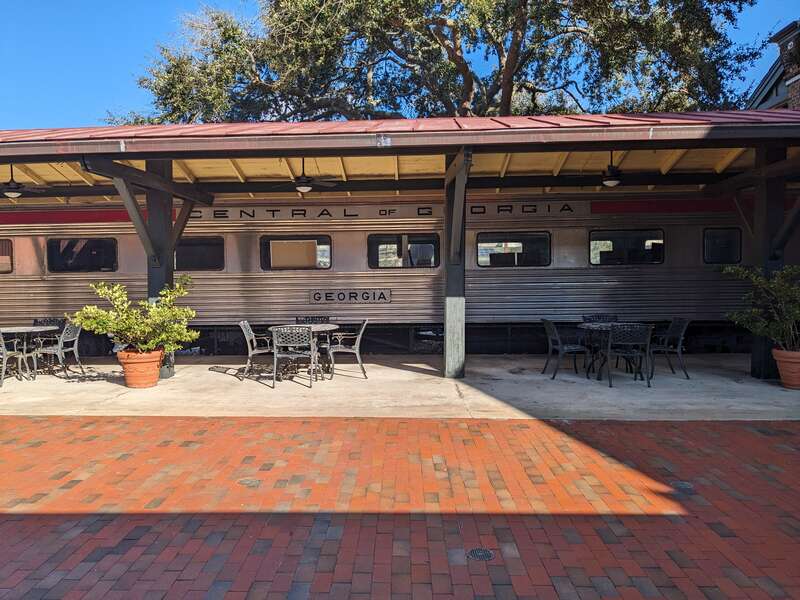 A restored Central of Georgia streamlined passenger car, on display outside the Savannah Visitor's Center