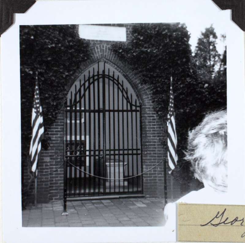 George Washington's tomb, Mt. Vernon, VA.
3.5x3.5 black-and-white photograph. Image from a scrapbook album belonging to Hazel Smothers, whose aviation highlights include copiloting her plane to 1st place in her class at the 1969 Powder Puff Derby air
