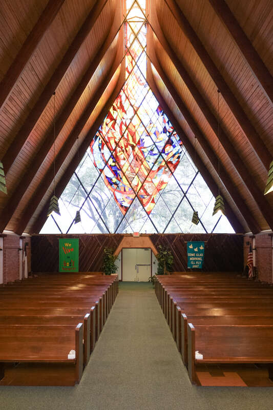 All Faiths Chapel interior, camera POV from stage area facing door. 