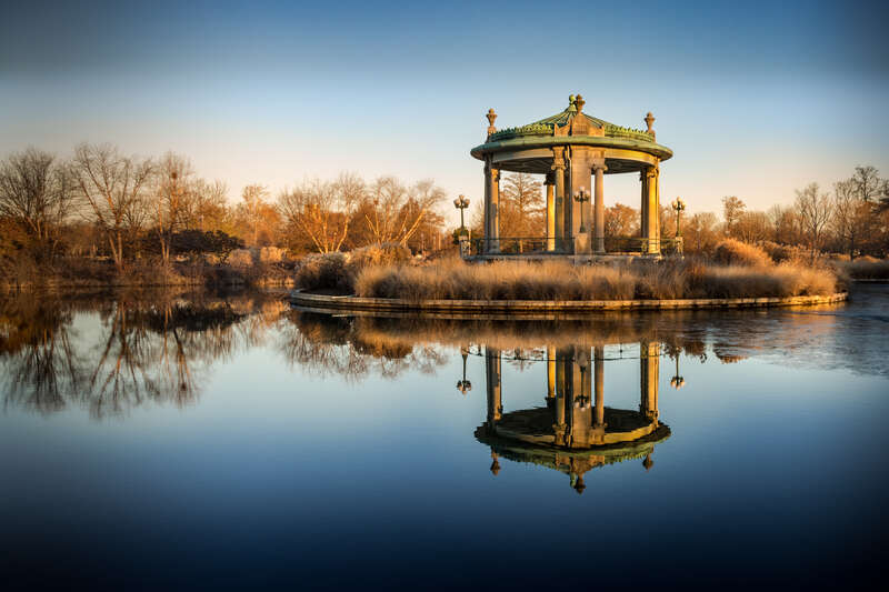There was originally an ornate wooden pagoda built at this site in 1876 that was renovated for the Saint Louis Worlds Fair in 1904. In 1911 it was destroyed by storm and fire while closed for repair. The site sat vacant until the current bandstand