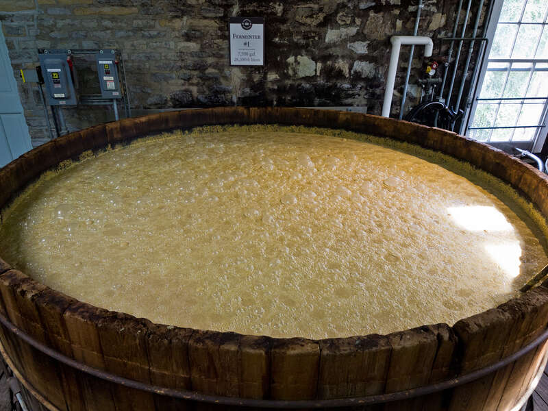 A fermentation vat, where yeast is added to mash, converting sugars in the mash to alcohol.Photo taken with an Olympus E-5 at the Woodford Reserve distillery, Versailles, Kentucky, USA.Cropping and post-processing performed with Adobe Lightroom.