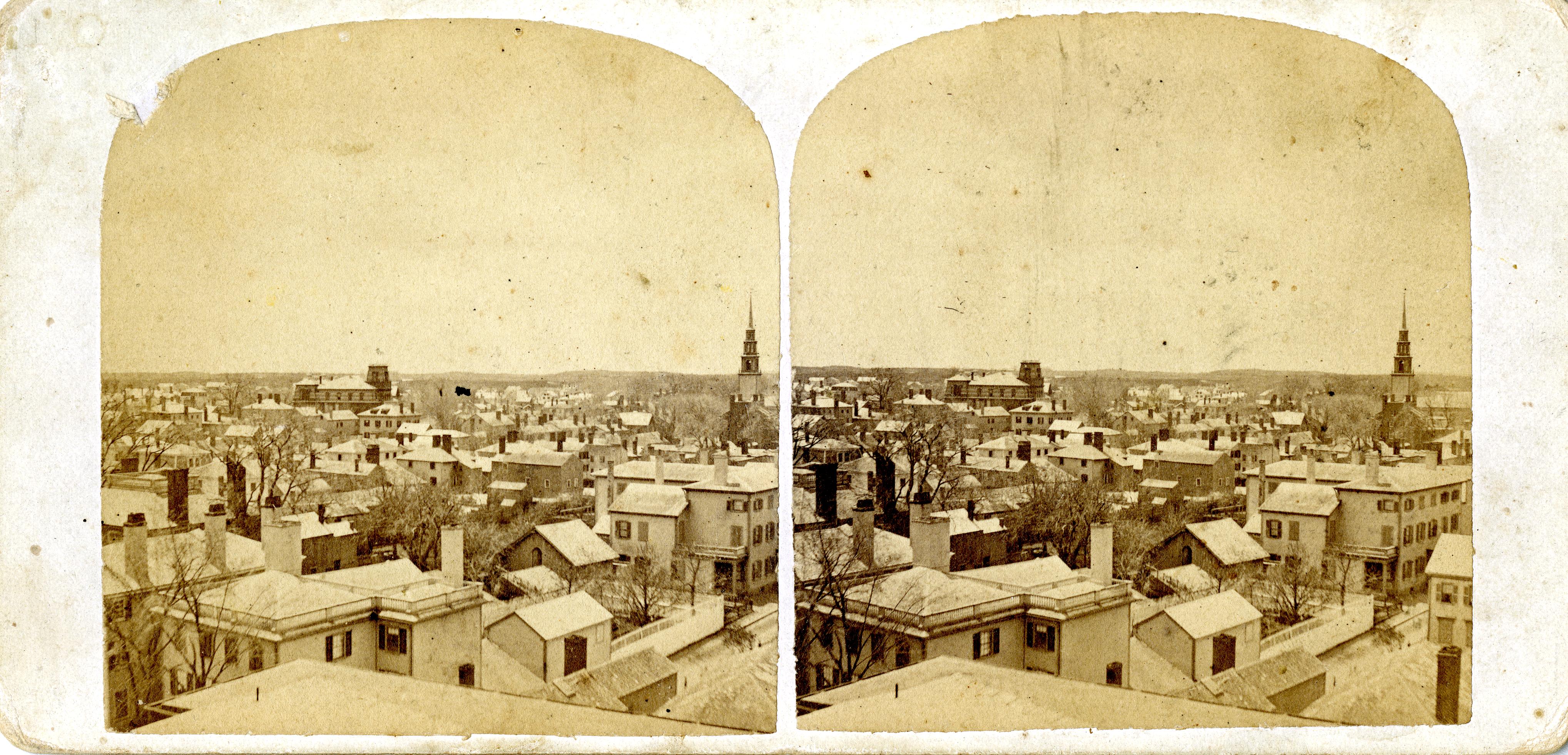 SV-008 — Nelson Dionne Collection. Birdseye view of Salem taken from the (non-extant) cupola of the Asiatic Building on Washington Street, looking west.
In the background, the Salem Normal School on Broad Street (left) and the spire of the