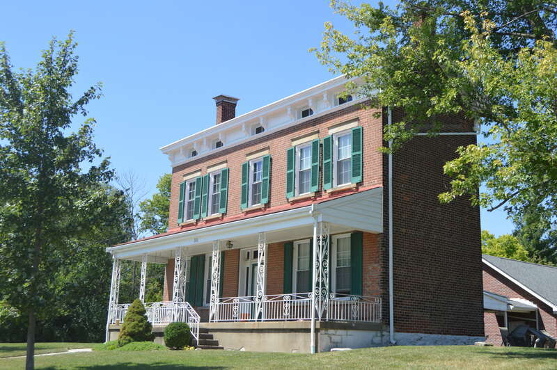 Front and eastern end of the Kruempelman Farmhouse, located at the junction of Kruempelman Drive and St. Johns Road in Fort Mitchell, Kentucky, United States.  Built in 1890, it is listed on the National Register of Historic Places.