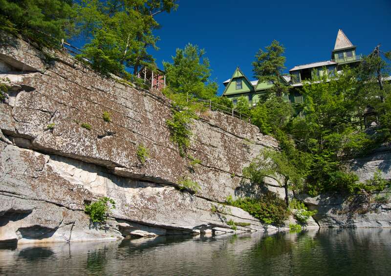 Shawangunk Conglomerate cliff shaped by glacial movement surrounding the Mohonk Lake at Mohonk Mountain House
