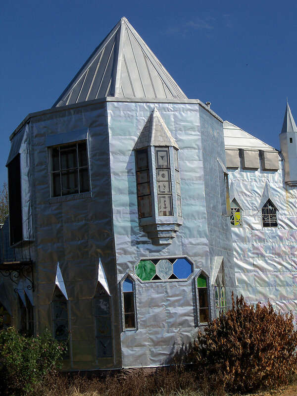 Solomon's Castle in Florida. 
&quot;Castle&quot; built from discarded materials and objects by an eccentric artist in swamps on Ona, Florida; walls are covered with used aluminum printing plates that reflect light.