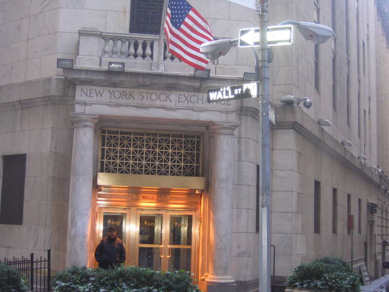 A close shot of Wall Street showing the north entrance of New York Stock Exchange