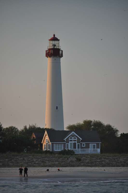 Cape May Lighthouse from a boat in early evening.