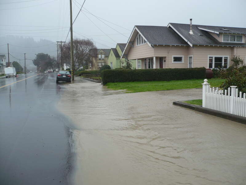 Older homes on Main Street Ferndale, California were built high for days like these.  Francis Creek washed down a large pile of sediment which ran over the banks in various places throughout town.  The brown color comes from sediments washed down