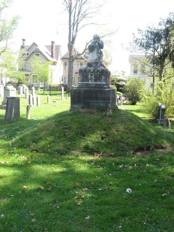 Gravestone on top of a miniature mound near the Conus Mound in Mound Cemetery in Marietta, Ohio, United States.  The cemetery is part of the Marietta Historic District, a historic district that is listed on the National Register of Historic Places.
