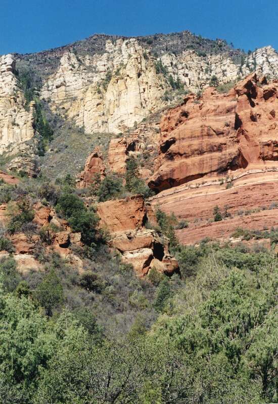 (1 of a multiple picture set.)
I took this picture from Slide Rock State Park in Oak Creek Canyon. Oak Creek has carved out a smooth chute here as it rushes down towards Sedona.  People can wiz down this natural slide going from one pond to another