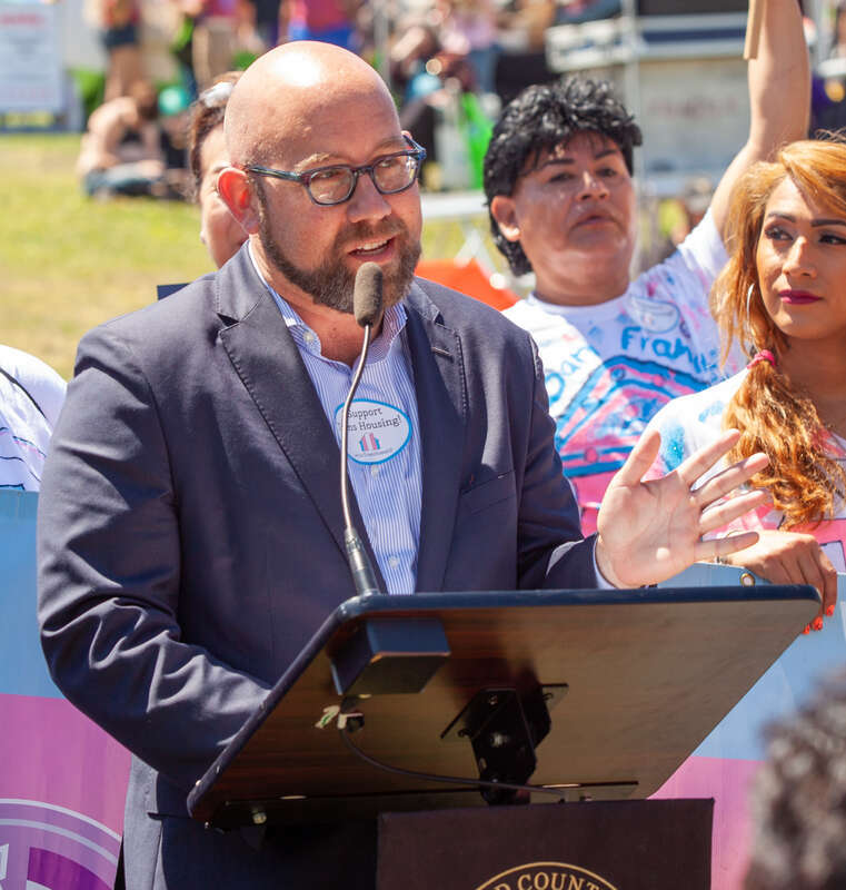 San Francisco Board of Supervisors member Rafael Mandelman speaks at a press conference at the 2019 San Francisco Trans March.