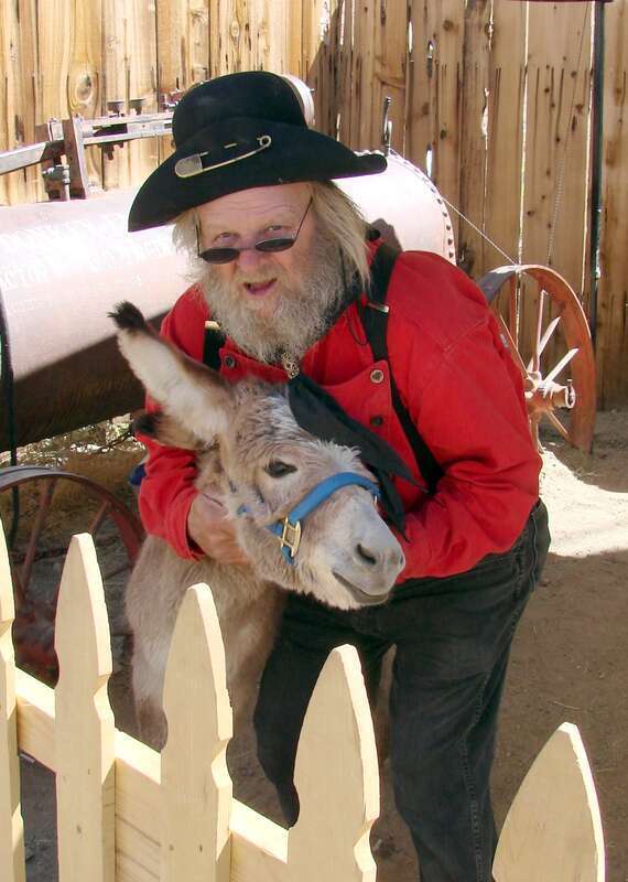 (1 in a 17-picture set)
This character represents the early prospectors who sought the elusive ore.  Those who found a vein usually sold it for a small amount of money, only to find later that the buyer had made millions.

The actor was proud of his