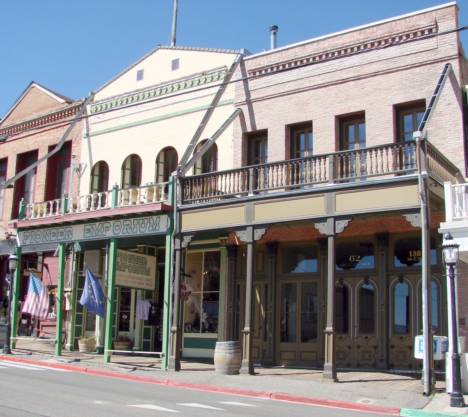 (1 in a 17-picture set)
A portion of the many buildings still in use on C Street (main street) in Virginia City. Note the rain gutters coming down from the roof.  These carry rain water into the street which slopes downhill to the south.  You can