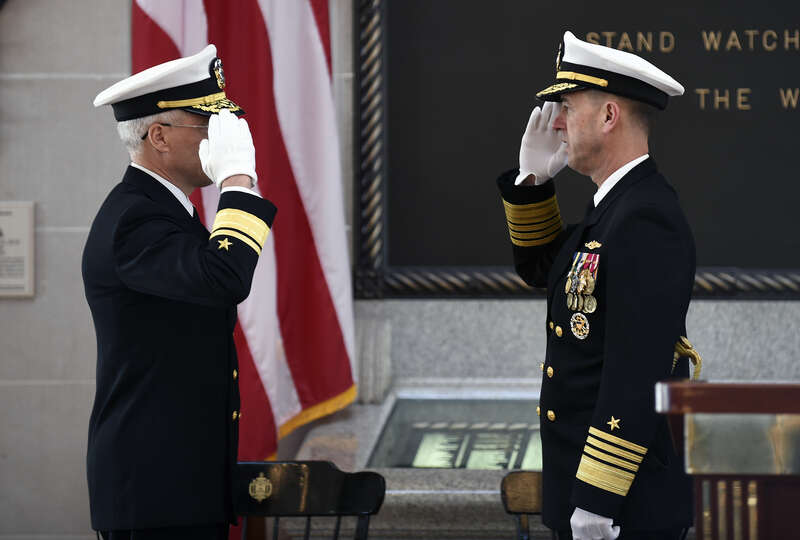 Rear Adm. Matthew Klunder, left, requests permission to retire from the U.S. Navy from Adm. John Richardson, director, Naval Nuclear Propulsion Program, during a ceremony held at the United States Naval Academy. Klunder was relieved as the Chief of