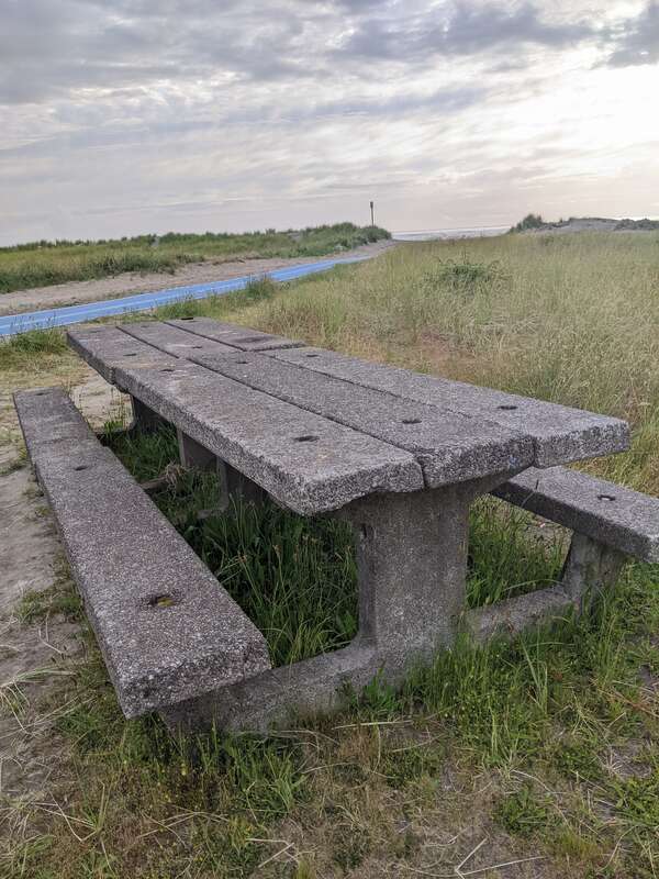 A concrete bench along Seaside Beach, Oregon