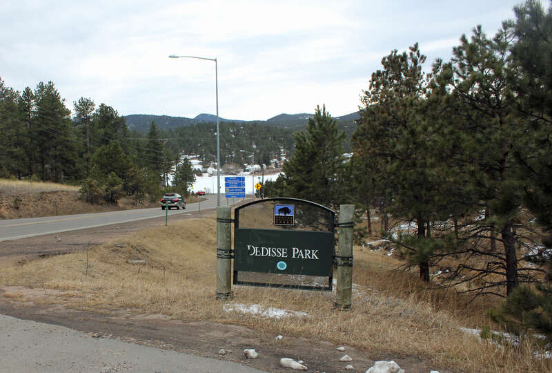Dedisse Park, located in Evergreen, Jefferson County, Colorado. The park is one of the Denver Mountain Parks. The road on the left of the picture is State Highway 74, and the frozen lake at the bottom of the hill is Lake Evergreen.