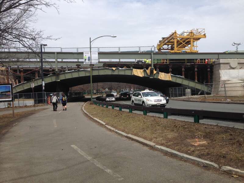 Span 2 of the Longfellow Bridge, which extends over Storrow Drive westbound and the Esplanade, is carefully demolished at night to minimize impacts