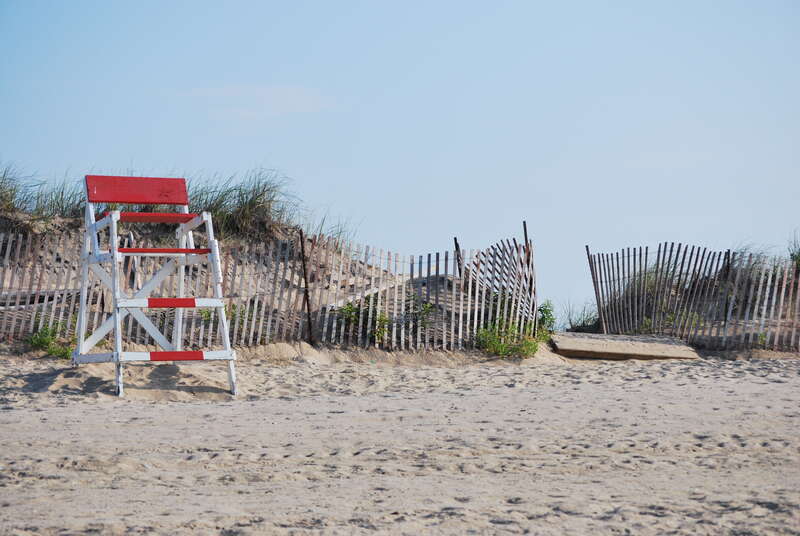 Entrance to Misquamicut Beach, Rhode Island beside a lifeguard tower.