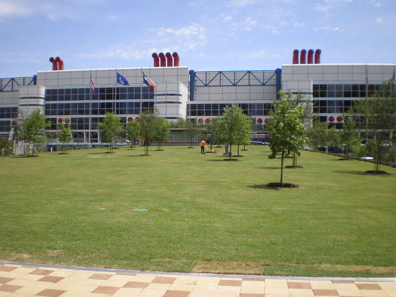 Grass lawn at Discovery Green in Houston, Texas. The George R. Brown Convention Center can be seen in the background.