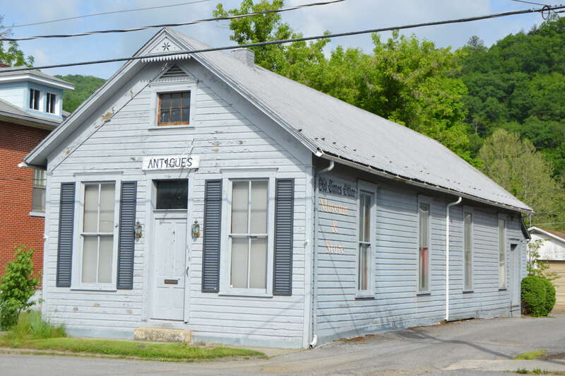 Front and northeastern side of the former print shop for the Pocahontas Times (now an antiques shop and museum), located at 810 Second Avenue in Marlinton, West Virginia, United States.  Built in 1900, it is listed on the National Register of