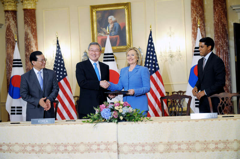 U.S. Secretary of State Hillary Rodham Clinton shakes hands with Korean Foreign Minister Kim Sung-Hwan after a signing ceremony at the U.S. Department of State in Washington, D.C., on June 24, 2011. [State Department photo/ Public Domain]