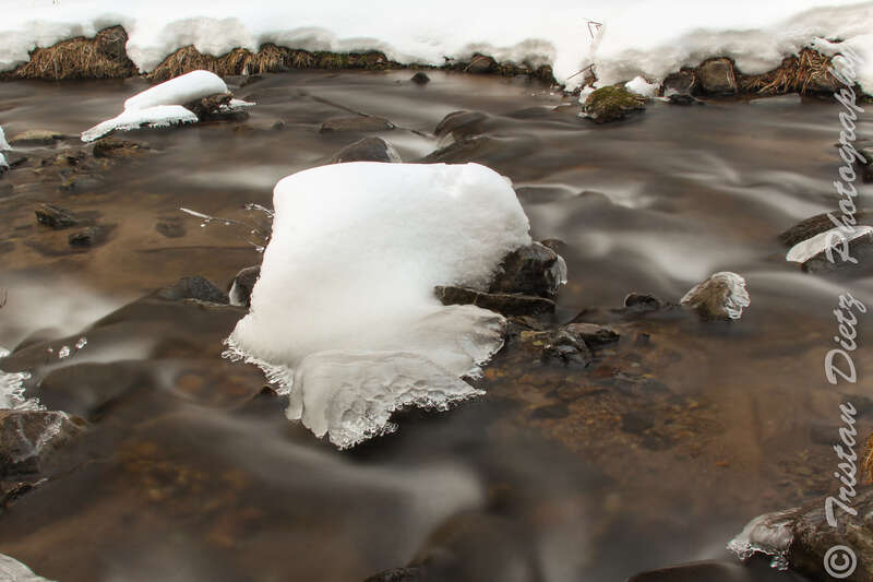 500px provided description: Ice and water flowing.  Used a ND filter to have a 20 second exposure! [#Creek ,#Long Exposure ,#ND Filter]