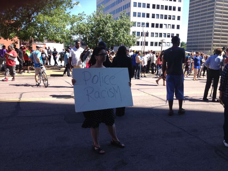 Supporter carries sign.