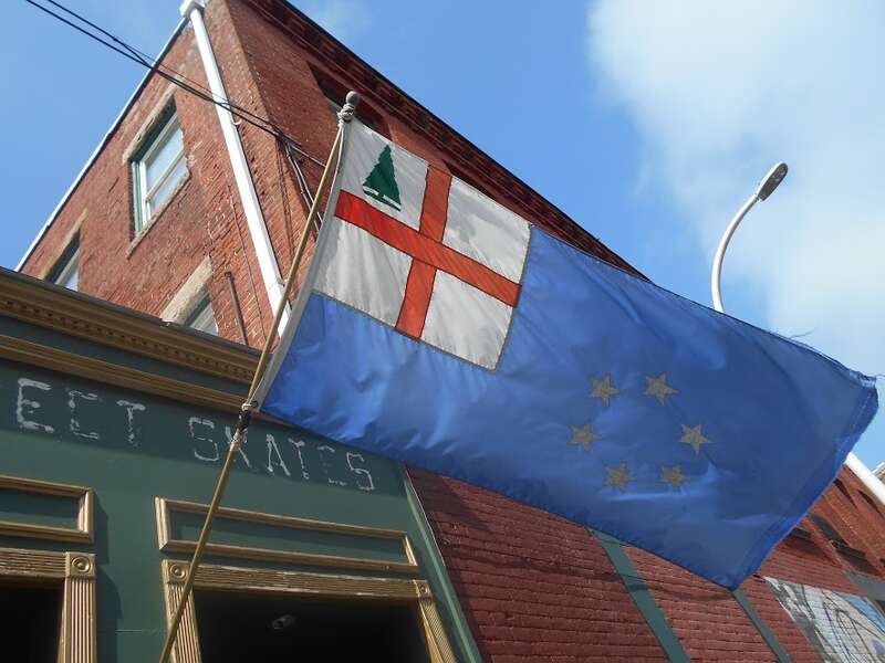 "The Flag of New England as designed by Albert Ebinger of Ipswich MA adopted by the New England Governor's Conference on 8 June 1988"
https://en.wikipedia.org/wiki/Flag_of_New_England