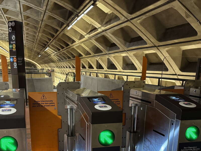 New installation of faregate terminal at L'Enfant Plaza with taller clear panel to discourage fare hopping.
