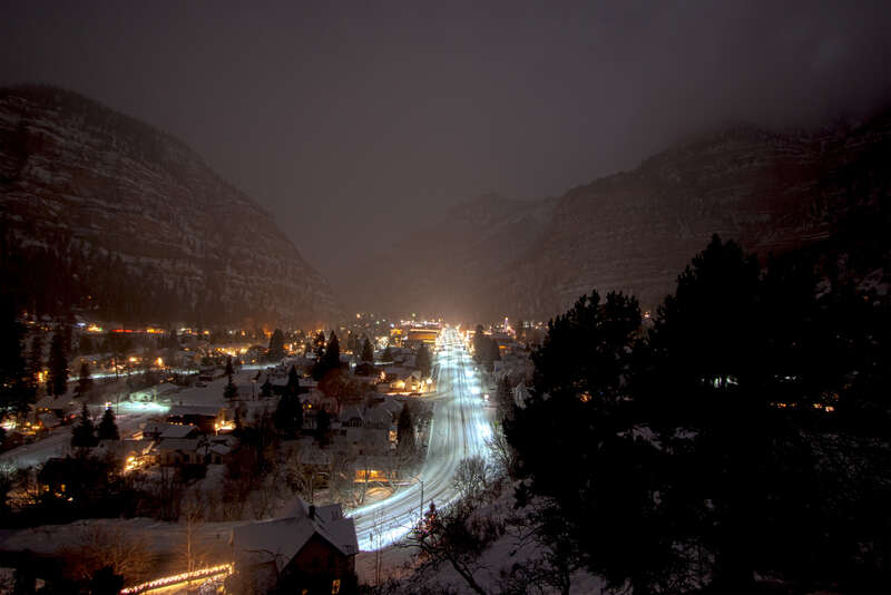 Ouray, CO on a winter night during a light snow storm.