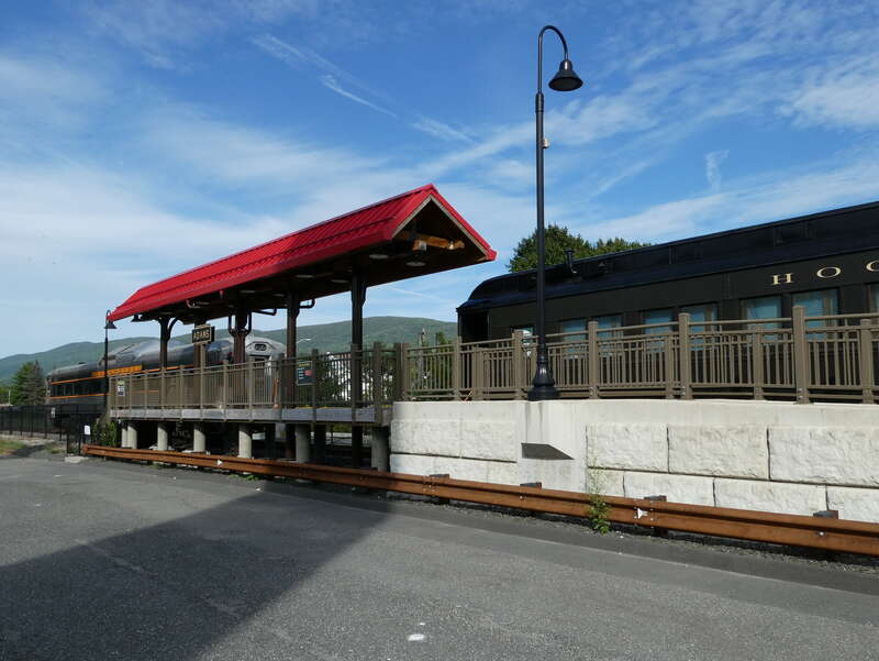 Combine coach #1444, built in 1927 for the Baltimore and Ohio Railroad, at Adams station in September 2022. At that time, the car was in use as the ticket office and gift shop for Berkshire Scenic tourist train operations. At left is ex-B&amp;amp;M RDC