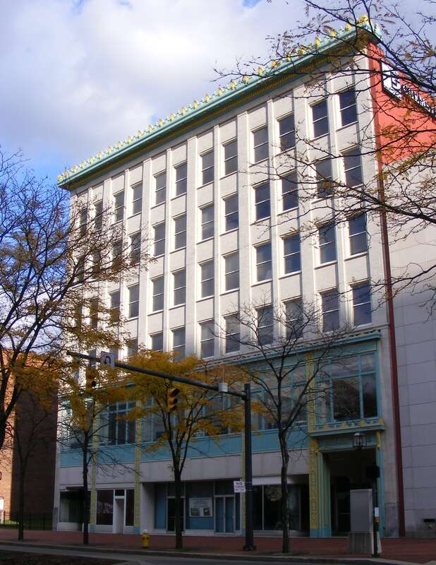 Situated on Akron’s Main Street, the Metropolitan Building opened in 1918, boasting its fireproof construction. Neo-Classic Revival/Chicago Commercial style in design, the building accommodated four storefronts and 100 office suites. The