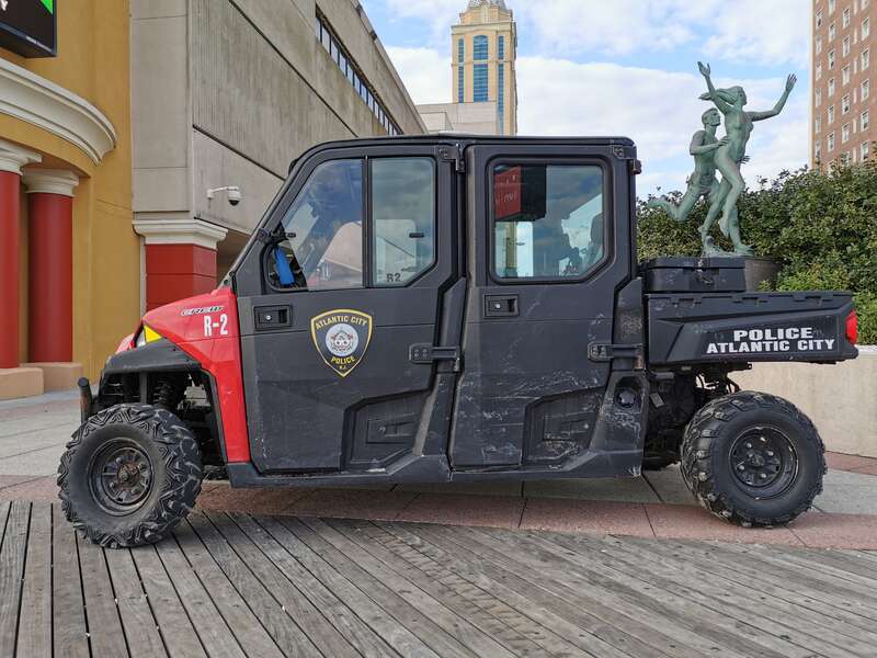 A Polaris Ranger Crew 900 EFI DOHC all-terrain vehicle patrols the Atlantic City Boardwalk under the authority of the Atlantic City Police Department. (Side view.)
The sculpture  “Summer” by Anthony Frudakis and the Tropicana casino are visible in
