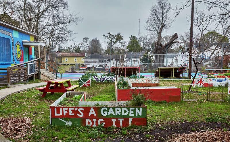 The colorful FYB Community Garden of the Front Yard Bikes community organization in the low-income Terrace Park neighborhood of Baton Rouge, the capital city of Louisiana.  Front Yard Bikes invites people of all ages to learn bicycle repair and