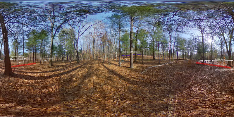 A wooded and hilly landscape. Trees are bare. Ahead on a low hill are four blue rectangles with the words &quot;Lexington militia&quot; above them. Pan to the right you will see words &quot;Rocky Outcrop. Pan to the right you will see two red rectangles and the