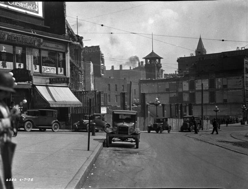 Work in progress building 2nd Avenue Extension  South, Seattle, Washington, U.S. Looking southeast from 2nd and Yesler, 1928. You can see where some of the buildings in the way of the street under construction already have portions &quot;shaved away&quot;;