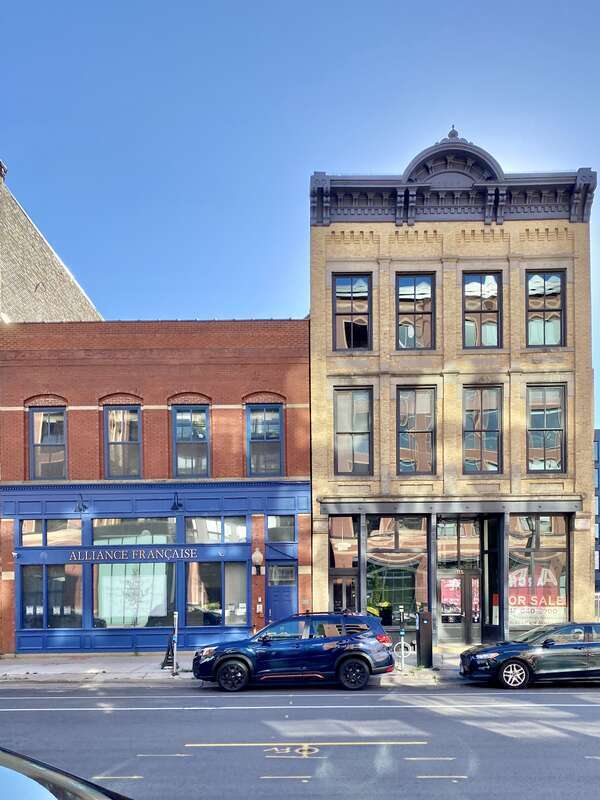 Built in 1883 and 1885, these two brick Italianate-style commercial buildings stand side by side on 1st Street in Minneapolis’s North Loop/Warehouse District.  The building to the south, built in 1885, features a red brick facade with arched second