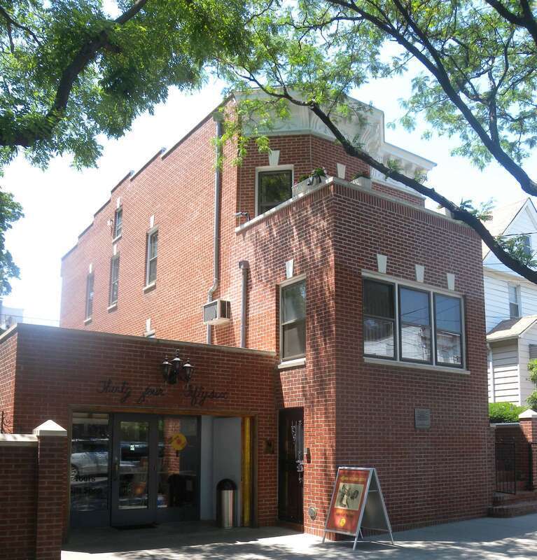 Louis Armstrong House, now a museum, 34-56 107 St., Corona, Queens, NY. Looking northwest from 107th Street at Armstrong Museum on a sunny midday.