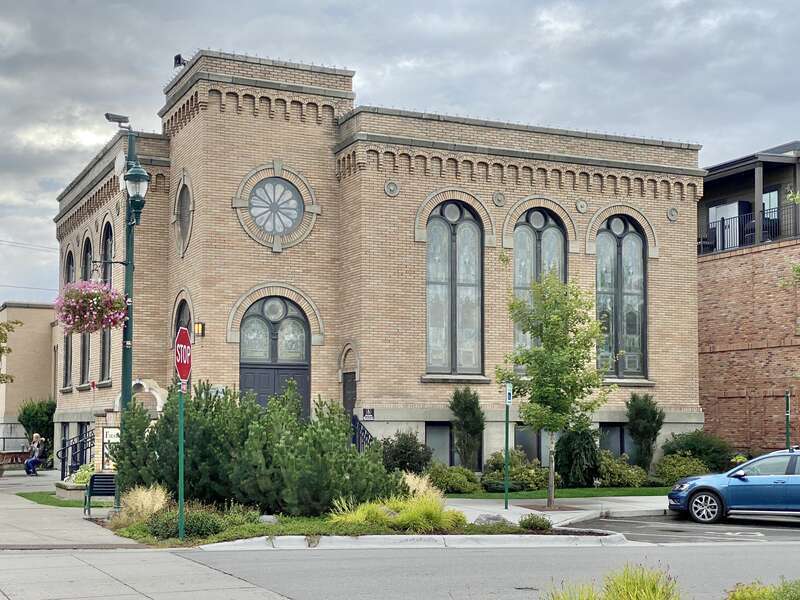 Built in 1921, this stripped and stark Romanesque Revival-style church, home to a Presbyterian congregation, stands at the corner of Central Avenue and 3rd Street in downtown Whitefish, Montana.