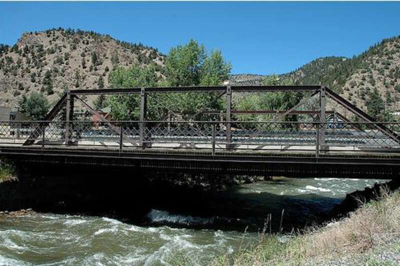Bridgepixing the Miner Street Bridge over Clear Creek in Idaho Springs, Colorado. This Steel Low Truss Bridge was built in 1902 and is listed on the National Register of Historic Places.