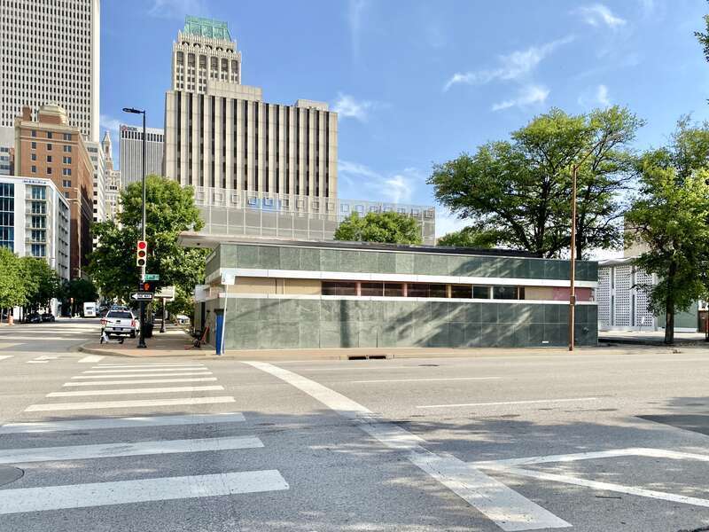 Built in 1956, this Modern International-style building was designed by Robert E. Buchner to serve as a branch of the Ponca City Savings and Loan, a bank.  The building complex consists of two structures, with the larger structure, set back deeply