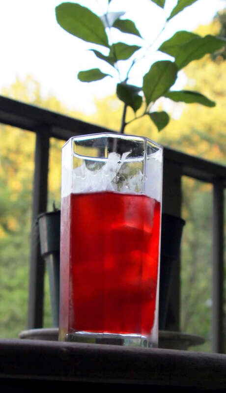 A cocktail known as an &quot;Alabama Slammer&quot;: 1 oz. amaretto 1 oz. Southern Comfort 1/2 oz. sloe gin Dash lemon juice Pour over ice cubes and stir. My little lemon tree is in the background.