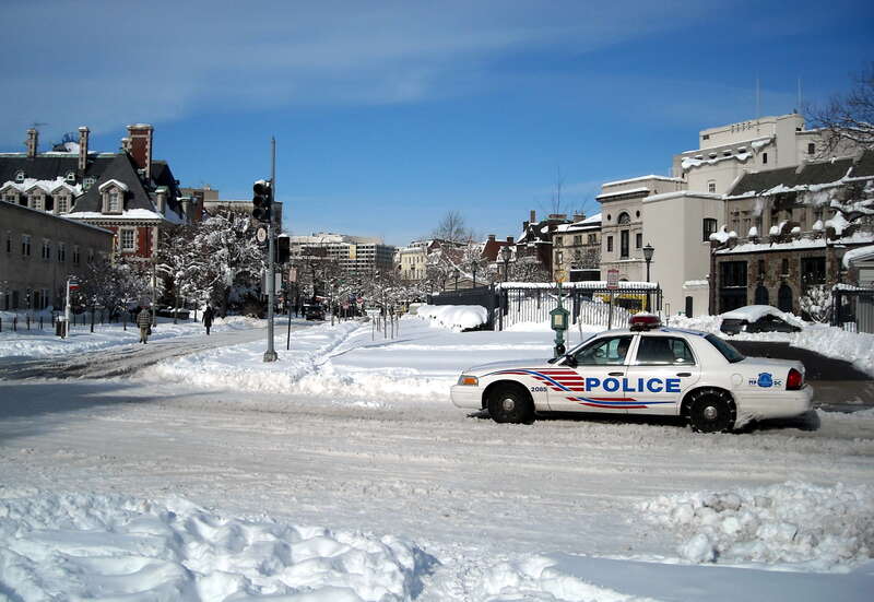 A District of Columbia Police Department vehicle approaches the intersection of 20th Street and Massachusetts Avenue, N.W., in the Dupont Circle neighborhood of Washington, D.C., following the First North American blizzard of 2010.