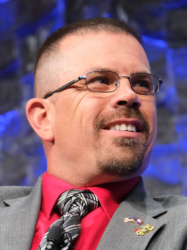 Wyoming State Representative Marshall Burt speaking on a panel at FreedomFest 2021 at the Rushmore Plaza Civic Center in Rapid City, South Dakota