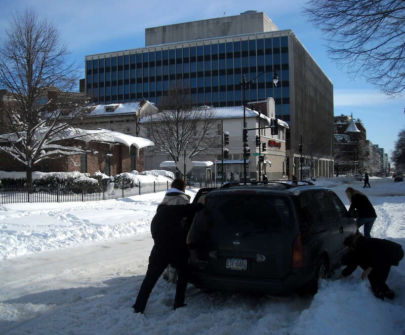 A Nissan Quest minivan stuck in the snow on 20th Street, N.W., (as viewed from Massachusetts Avenue, N.W.; facing south) in the Dupont Circle neighborhood of Washington, D.C., following the North American blizzard of 2010.