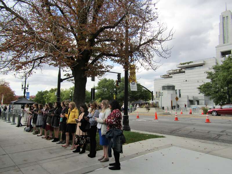 A choir of young women singing near the end of General Conference.