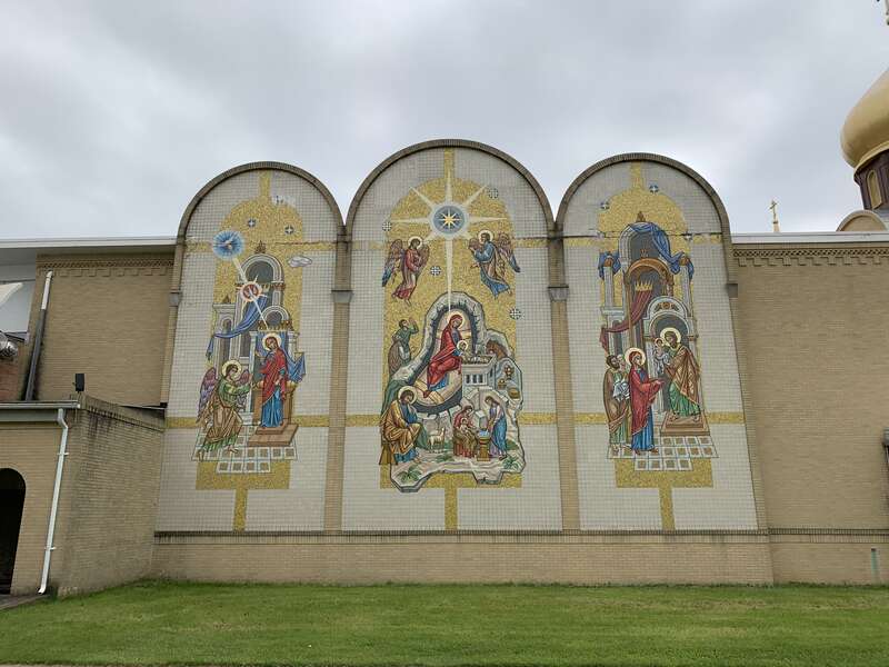 Close up of a mural on the east side of the Cathedral of St. John the Baptist in Parma OH in May 2019.