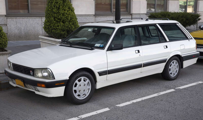 A 1992 Peugeot 505 DL Station Wagon in White. 2.2-litre engine and an automatic, but an amazing car. Peugeot stopped building cars destined for the US in September 1991, so this is one of the very last ones imported. Spent several decades in Vermont