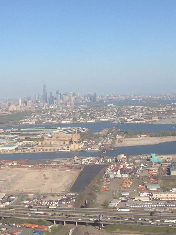 View of the New Jersey Turnpike spurs and Lower Manhattan while descending into Newark Liberty International Airport