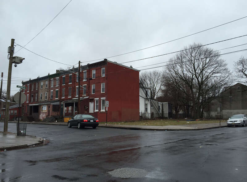 Row homes and an empty lot at the intersection of Monmouth Street and Walnut Street in the Greenwood/Hamilton section of Trenton, New Jersey